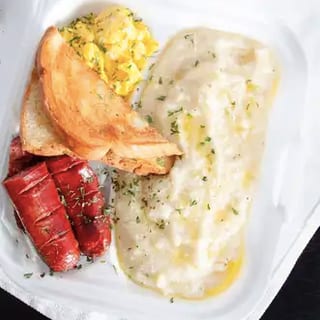 2 Eggs with Grits or Hash Browns & Toast